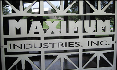 Maximum Industries - 1/4” aluminum--abrasive waterjet cut grill in lobby of Maximum Industries